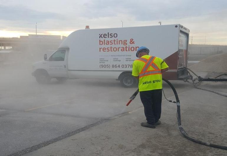 Pavement line removal with abrasive blasting